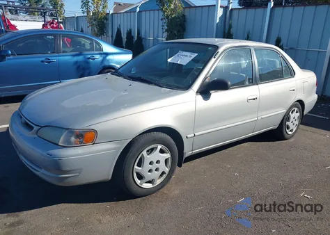 1999 Toyota Corolla Ce/Le из США, поврежденный, VIN 2T1BR12E2XC747502